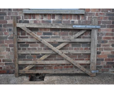 A wooden five bar farm gate, height 132cm, width 180cm.PROVENANCE: The Raymond Rush Collection. Mr Rush was an engineer, farm