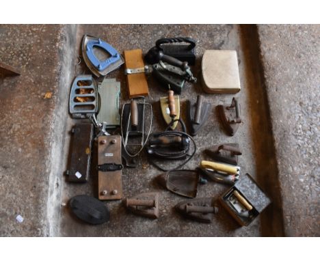 A collection of vintage laundry irons, including iron and brass examples.PROVENANCE: The Raymond Rush Collection. Mr Rush was