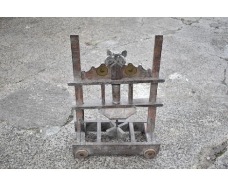 A vintage wood butter/milk churn cart, with a rise and fall paddle section, on rectangular base fitted with four circular woo