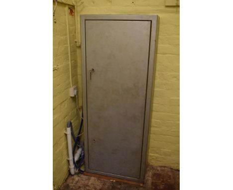 A grey painted steel gun cabinet, with two locks and interior with dividing bar for nine guns, height 153cm, width 62cm, dept