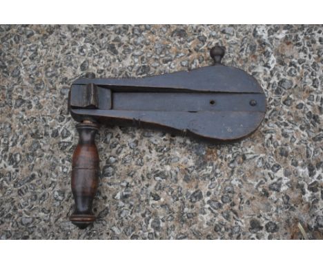 A 19th century treen bird scarer, with turned wooden handle, length 26cm.PROVENANCE: The Raymond Rush Collection. Mr Rush was