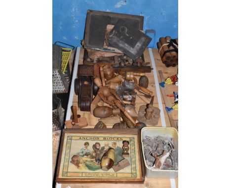 A collection of early 20th century and later treen children's toys, including a small selection of farm animals, various spin