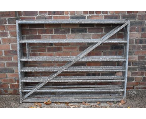 Three galvanised five bar gates, height 114.5cm, width 150cm.PROVENANCE: The Raymond Rush Collection. Mr Rush was an engineer