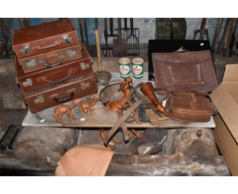 A selection of vintage leather items including a Perfecta no.75 satchel, width 24cm, a larger tan lather satchel, four suitca