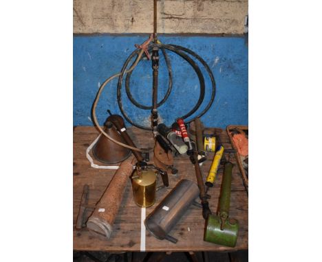 A collection of weed and bug killers including a brass and iron example, model no.4, a green and brass tin example, and a vin