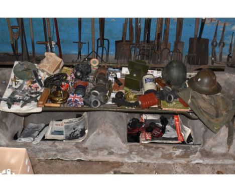 A collection of WWI and later military and related items, including a small selection of brass buttons, two gas masks, an ARP
