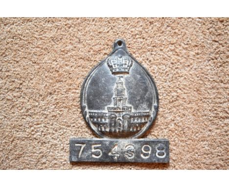 A cast lead fire mark for Royal Exchange Association (1720-1968), with policy no.754398, height 19cm.PROVENANCE: The Raymond 