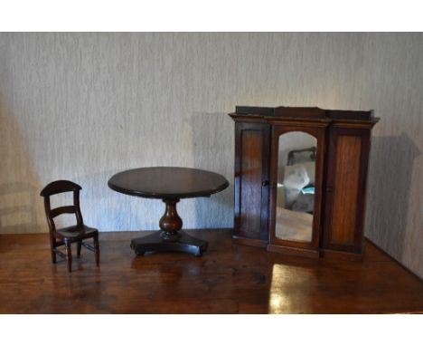 A Victorian miniature apprentice table modelled as a circular mahogany breakfast table, with turned column on triform base, h