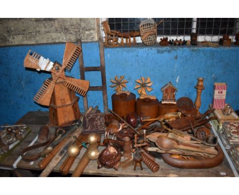 A selection of predominantly 20th century vintage treen items including various kitchen ladles and paddles, a French model wh