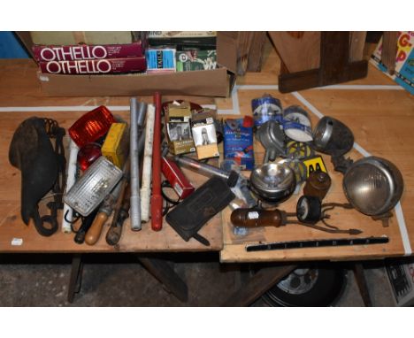 A collection of vintage automobile and cycling items including a Butler's headlamp, a P&H headlamp, a black leather BSA pouch