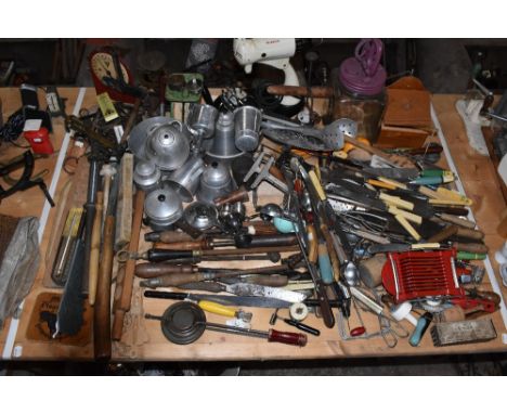 KITCHENALIA; a collection of vintage kitchen items including a butter paddle jar, various items of cutlery, scales, steel sha