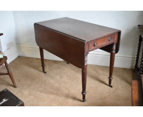 An early 19th century mahogany Pembroke table, with drawer and raised on turned and tapered legs, height 69cm, width 91cm, de
