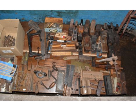 A large assortment of vintage carpentry tools including planes, moulding planes, rulers, etc.PROVENANCE: The Raymond Rush Col