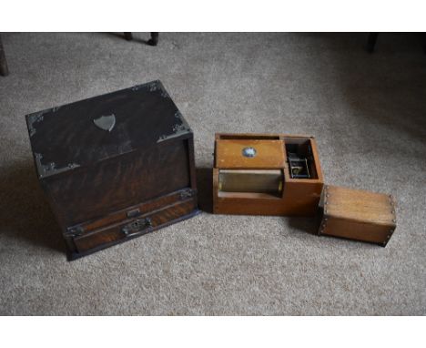 A Victorian oak smoker's box with drawer and tambour enclosing a fitted interior, on plinth base, height 25cm, width 31.5cm, 