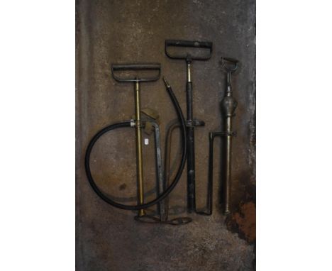 Three vintage stirrup pumps, including a 'NO 1 The Iron Arm' example in brass (3).PROVENANCE: The Raymond Rush Collection. Mr