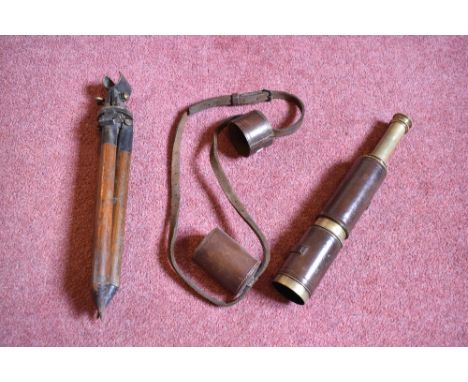 A 19th century lacquered brass two draw telescope, with leather mounted barrel, length when extended 61cm, with an associated