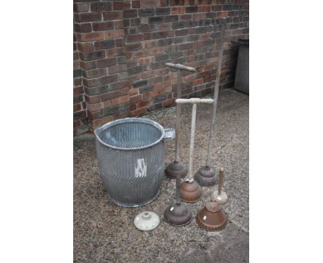 A vintage galvanised wash tub, height 52cm, four copper head wash dollies and two loose wash dolly heads (7).PROVENANCE: The 