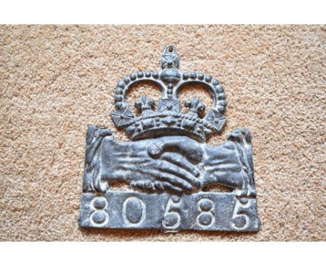 A cast lead fire mark for Hand in Hand Insurance (1696-1905), with policy no.80585, height 22cm.PROVENANCE: The Raymond Rush 