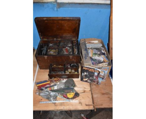 An assortment of Meccano pieces in a stained wooden box, and various Meccano magazines, etc.PROVENANCE: The Raymond Rush Coll