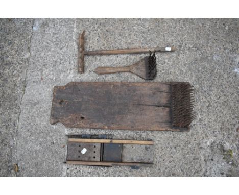 Two vintage treen and wrought iron carding tools, the smaller with carved detailing, the larger 65cm, also a small ash rake, 