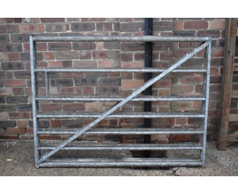 Two galvanised five bar gates, height 114.5cm, width 150cm.PROVENANCE: The Raymond Rush Collection. Mr Rush was an engineer, 