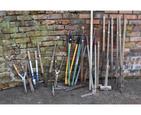 A collection of twenty agricultural and garden tools including lawn edge cutters, garden shears, two long armed cutting scyth
