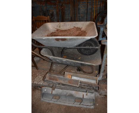 Two galvanised wheelbarrows and five galvanised animal feeders.

PROVENANCE: The Raymond Rush Collection. Mr Rush was an engi
