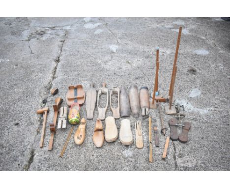 An assortment of vintage treen boot tree sections, also a selection of treen shoe size measurers and other items. PROVENANCE: