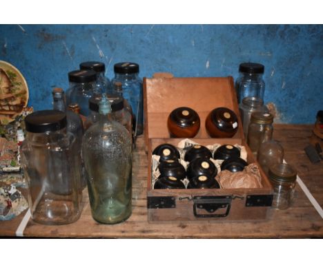 An assortment of vintage sweet jars and kitchen jars, a boxed set of eight wood and ivory bowls, two lignum vitae vintage bow