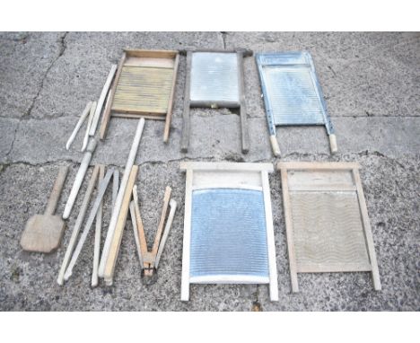 Five vintage treen and galvanised wash boards, height of tallest 70cm, also a wash paddle, six clothes pincers and two other 