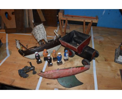 A child's toy pond boat, with wooden hull and metal tiller, 36cm, a wooden model of a twin masted pirate ship, a painted wood