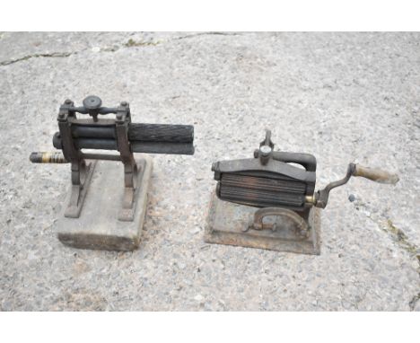 An American cast iron crimper by North Bro's Philadelphia with turned wooden handle, and a similar vintage crimper on pine ba