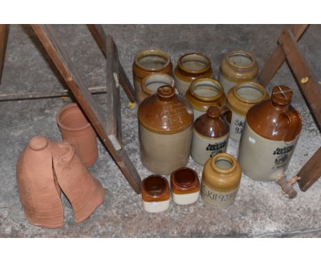 A collection of stoneware jars including a J. J Rolfe Brewer and Spirit Merchant Kings Lynn 1 gallon measure, a Zummerzet scr