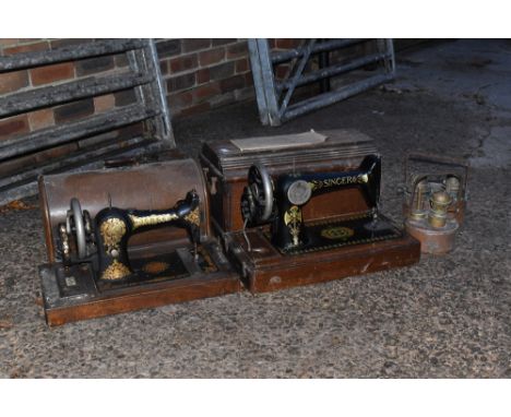 A Singer sewing machine, a Jones sewing machine and two copper lamps (4).PROVENANCE: The Raymond Rush Collection. Mr Rush was