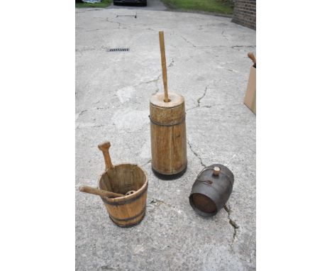 A vintage pine butter barrel with circular cover and paddle, height 40cm, also a milk pail, a pierced paddle and a stained oa