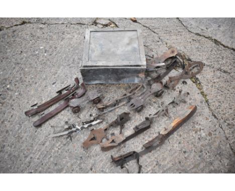 A box of assorted vintage roller skates and ice skates. PROVENANCE: The Raymond Rush Collection. Mr Rush was an engineer, far