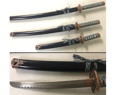 A set of 3 modern Japanese samurai style swords in black scabbard. With blue and white fabric grips to handles. Largest appro