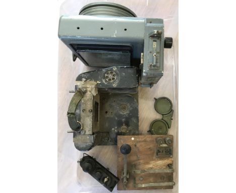 A small collection of military items. To include part of a Reconnaissance Camera and an Air Ministry Buzzer practise mores ke