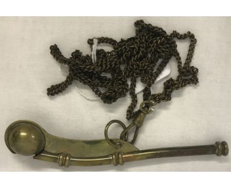 A vintage brass Bosun's whistle on chain.  