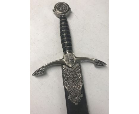 A replica Prince of Wales sword with "Honi soit Qui mal Y Pense" inscription on pommel. With dragon detail to cross guard and