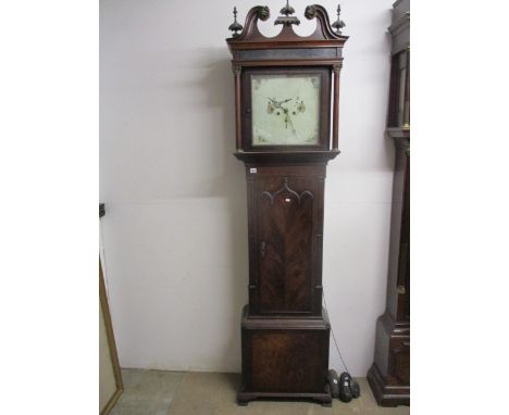 An early 19th century boxwood and ebony inlaid mahogany longcase clock, having a swan neck pediment over turned columns, the 