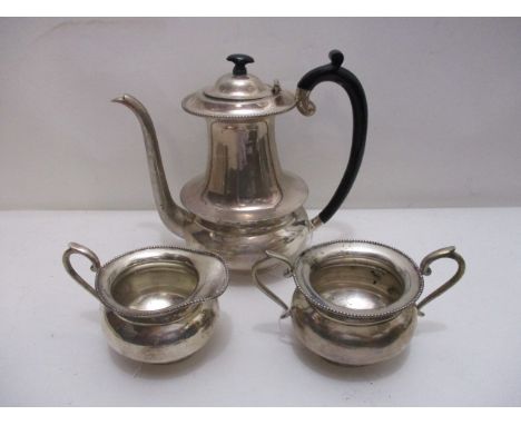 An Indian silver three piece coffee set of oval form with bead decoration stamped sterling silver comprising a coffee pot, a 