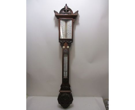 A Victorian carved walnut cased barometer decorated with foliage, the glass face inscribed J H Steward 456 West Street, Londo