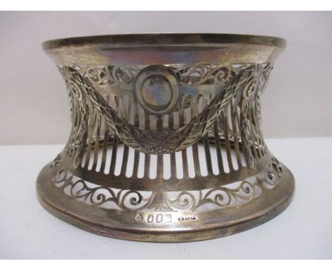 An early 20th century Irish silver dish ring by S D Neill, Dublin 1911 of waisted form with wreath swag and rosette embossed 