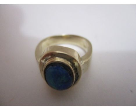 A 9ct gold ring set with an oval opal coloured cabochon, 6.8g