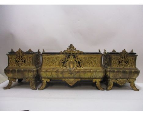A late 19th century/early 20th century gilt metal three piece planter set, each having raised, pierced floral and foliate dec