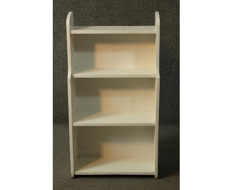 A vintage white painted open bookcase. H.84 W.45 D.16cm. 