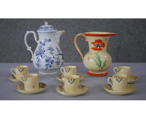 A Mintons Art Deco colourful abstract design six person coffee set along with a floral design jug and a blue and white hand p