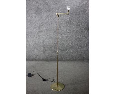 A vintage brass extending standard lamp with hinged articulated arm. H.153 (fully extended) Dia.28cm. 