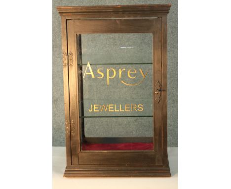 A vintage painted pine table top display cabinet later painted; Asprey Jewellers. H.64 W.38 D.38cm. 